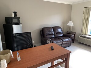 Suite, 1 King Bed, Non Smoking | Living area | TV