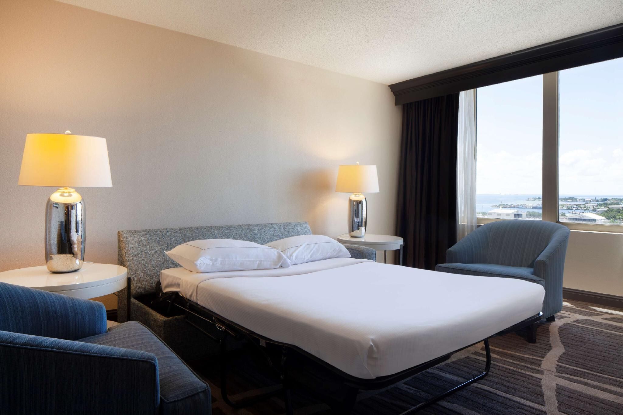 Premium bedding, down comforters, pillowtop beds, in-room safe