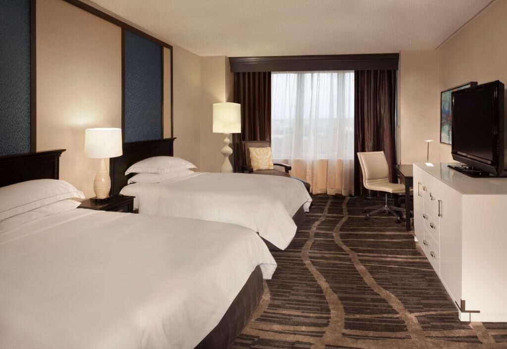 Premium bedding, down comforters, pillowtop beds, in-room safe