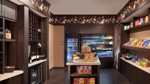A well-stocked minibar with various beverages, snacks, and condiments.