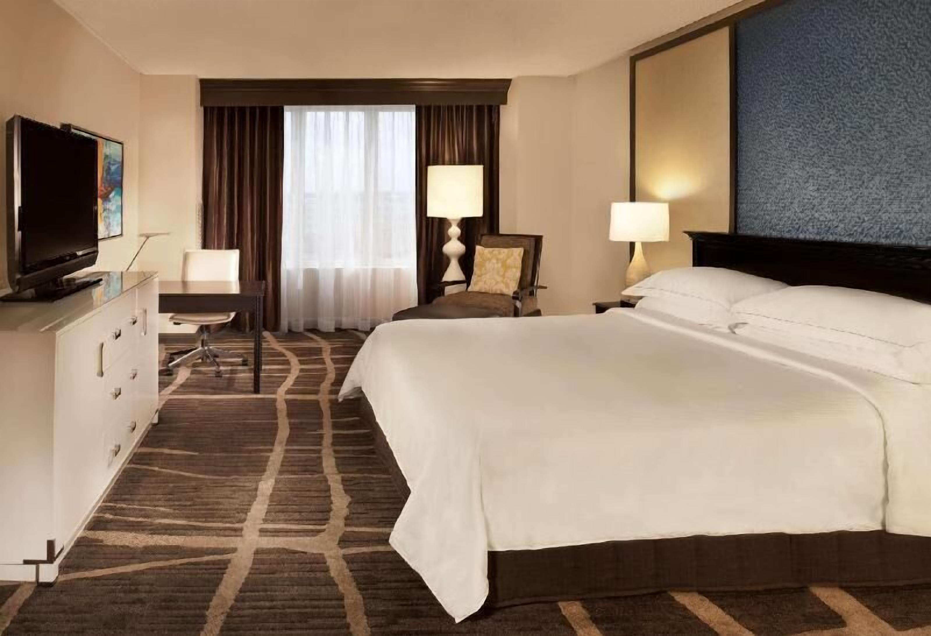 Premium bedding, down comforters, pillowtop beds, in-room safe