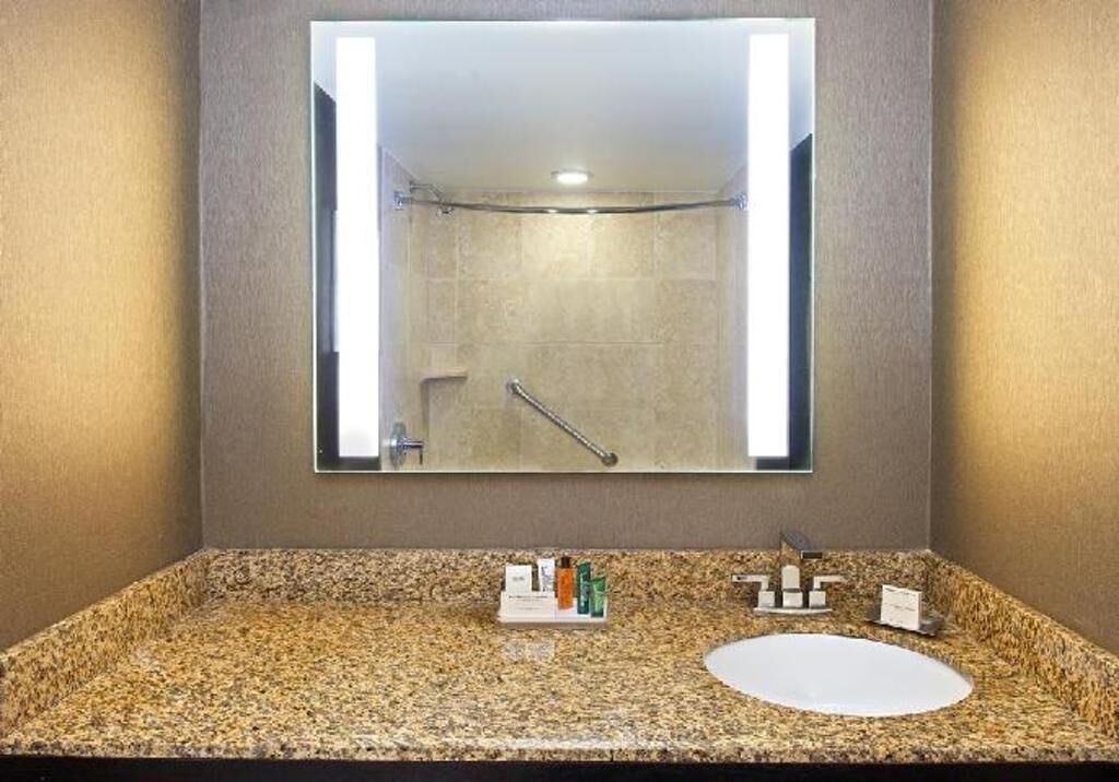 Bathroom | Shower, designer toiletries, hair dryer, towels