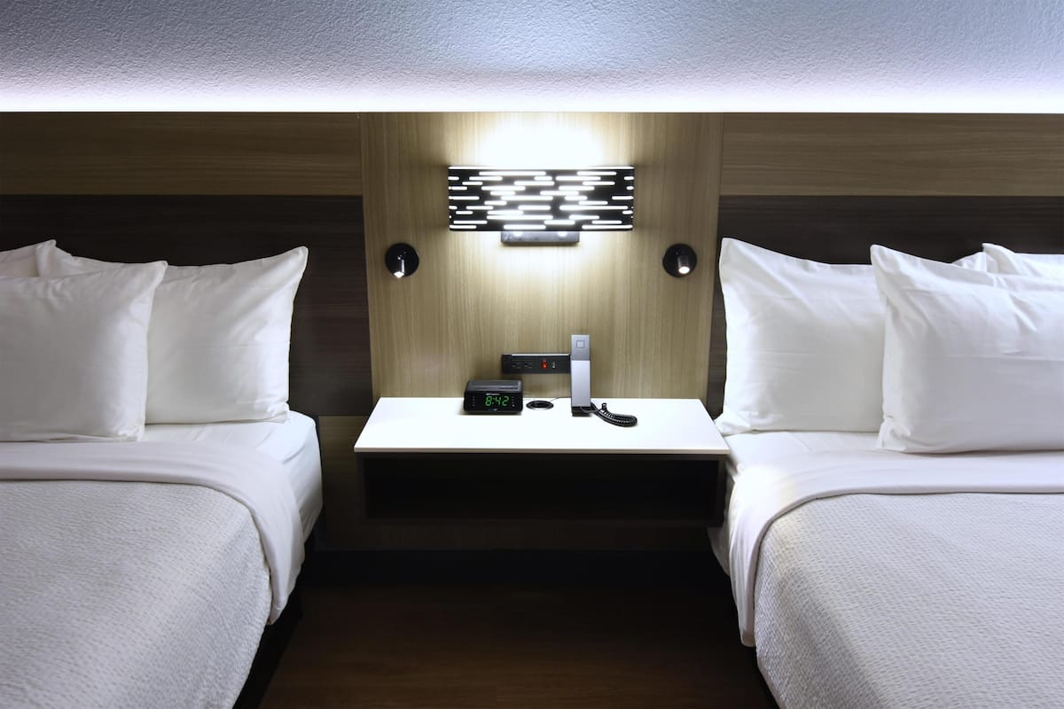 Premium bedding, down comforters, memory foam beds, in-room safe