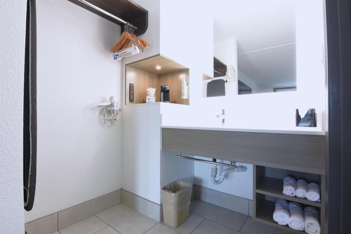 Premium bedding, down duvets, memory-foam beds, in-room safe