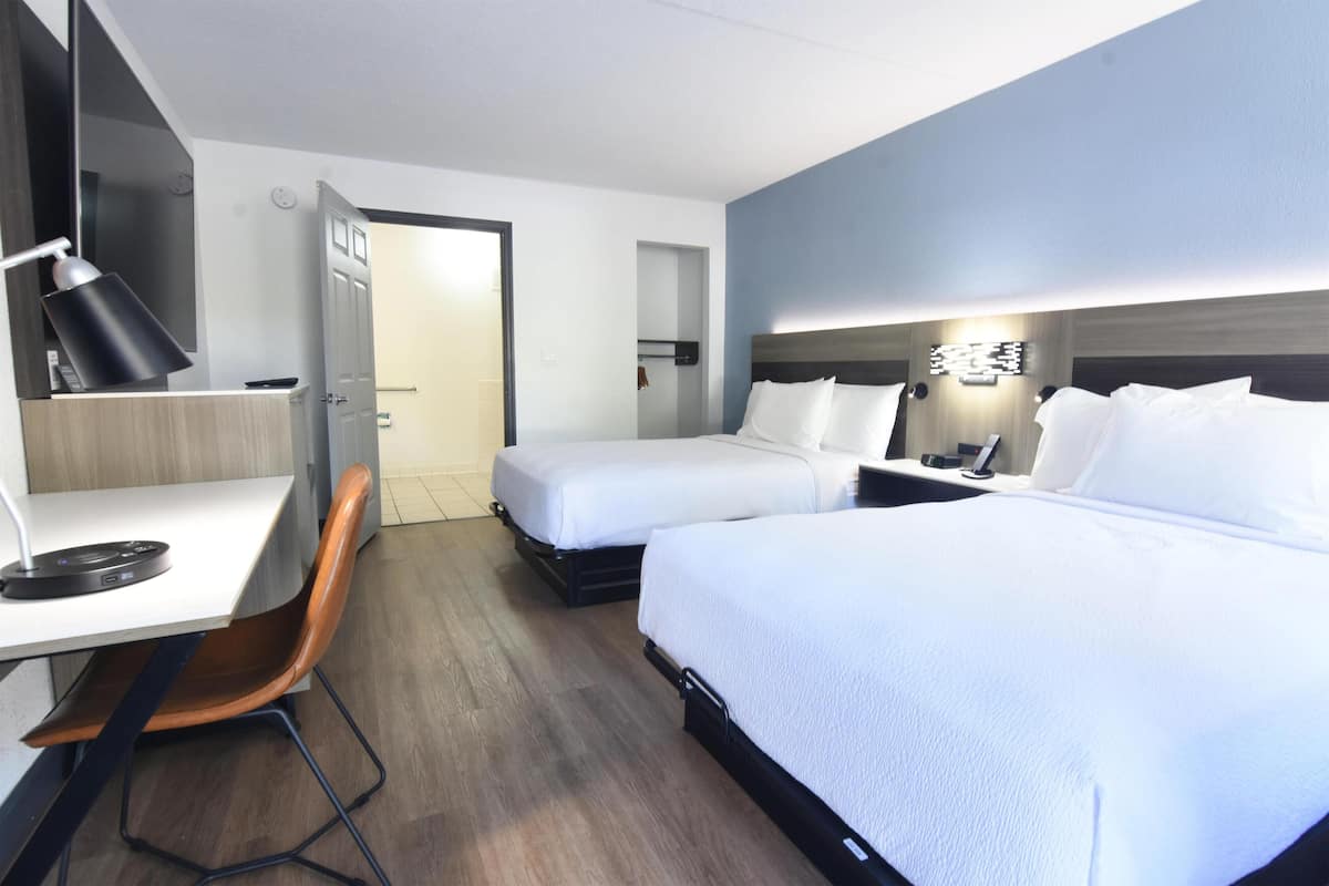 Premium bedding, down comforters, memory foam beds, in-room safe