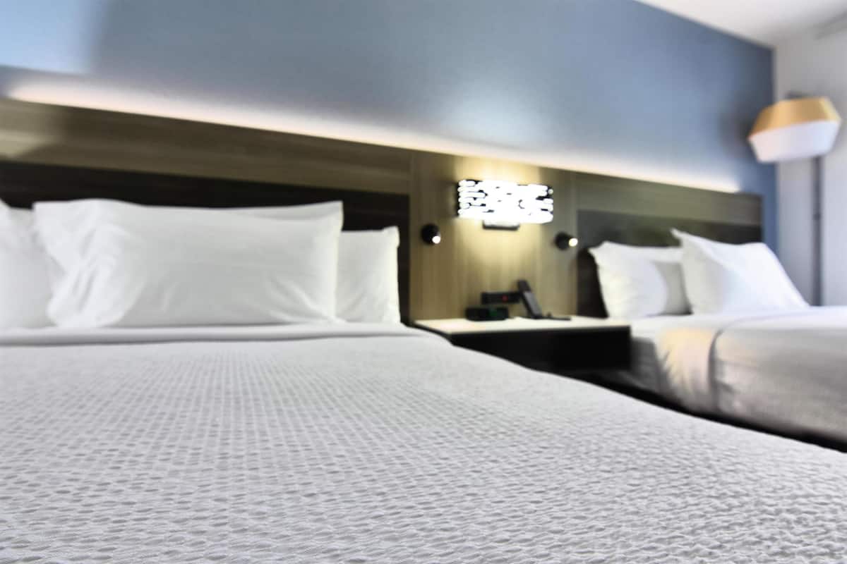 Premium bedding, down comforters, memory foam beds, in-room safe