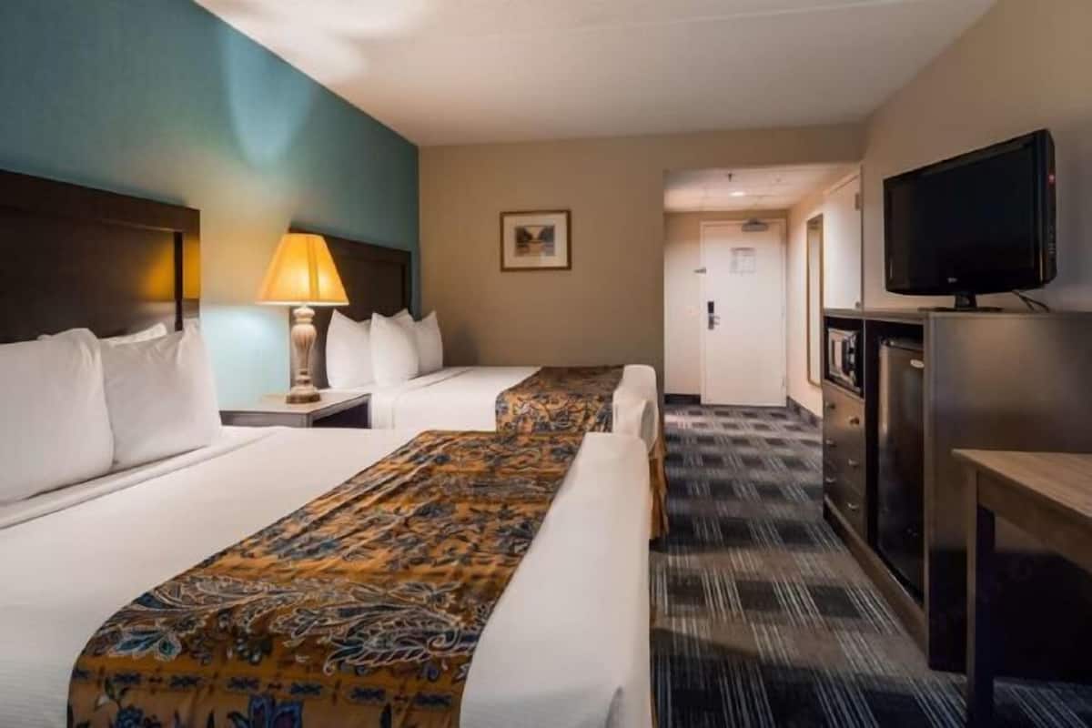 Premium bedding, desk, laptop workspace, blackout curtains