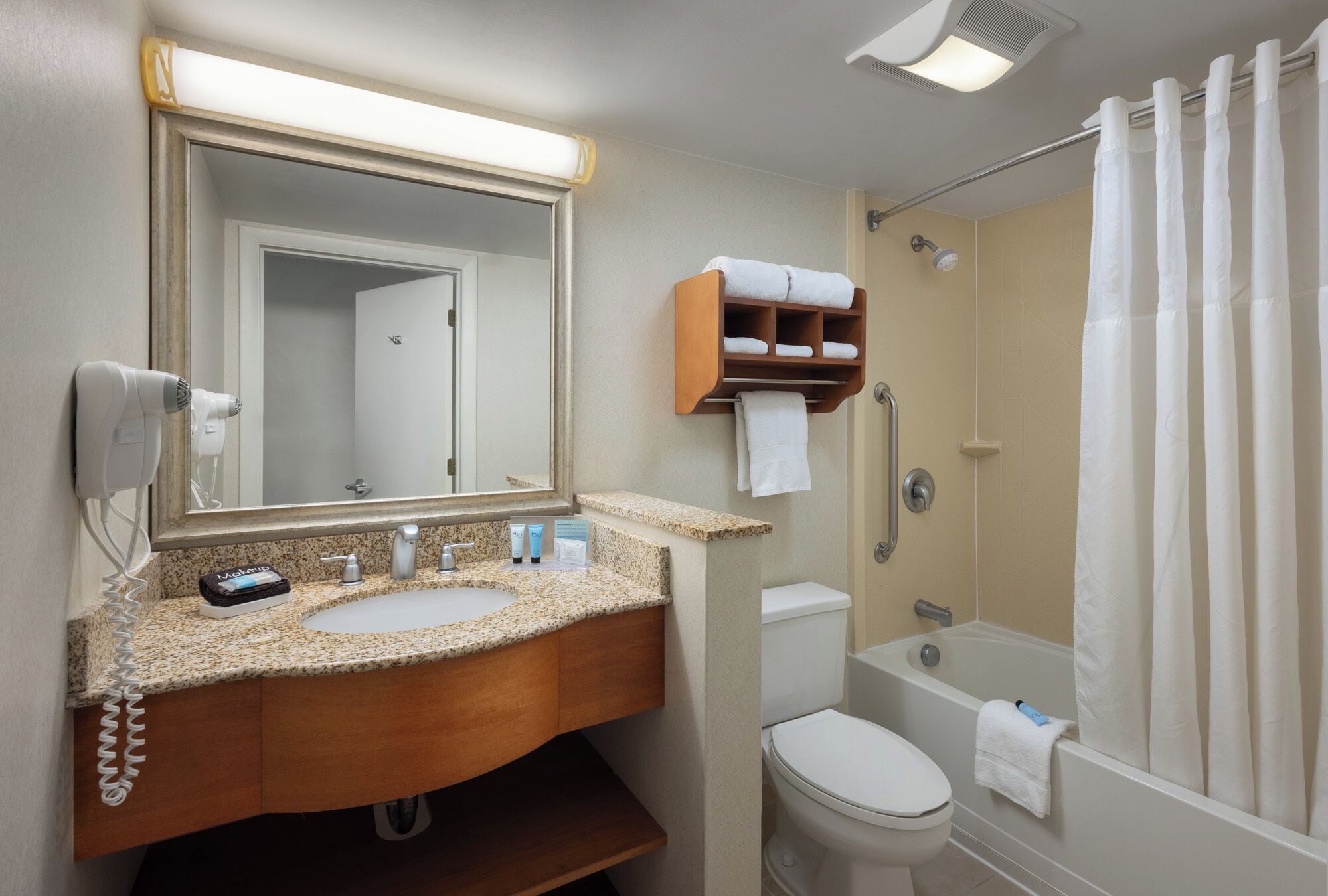 eco-friendly toiletries, hair dryer, towels