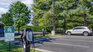 An electric vehicle charging station with a sign indicating it's for hotel guests only. - Best Western Plus Inn at Valley View (Roanoke)