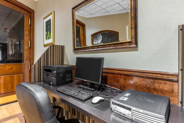A home office with a desktop computer, monitor, keyboard, mouse, and printer on a wooden desk. - Quality Inn Savannah Midtown (Savannah)