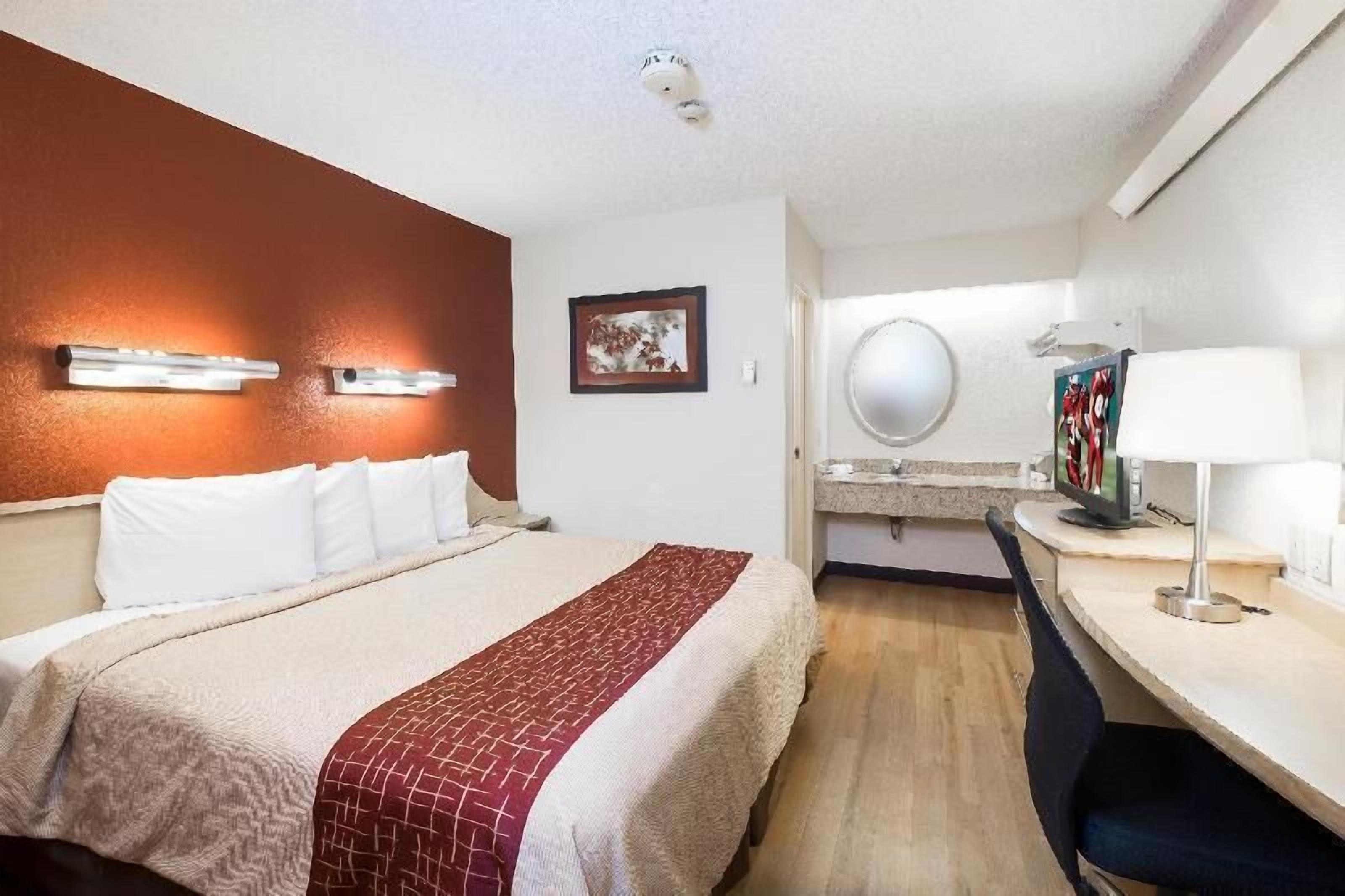 Premium bedding, desk, laptop workspace, blackout curtains