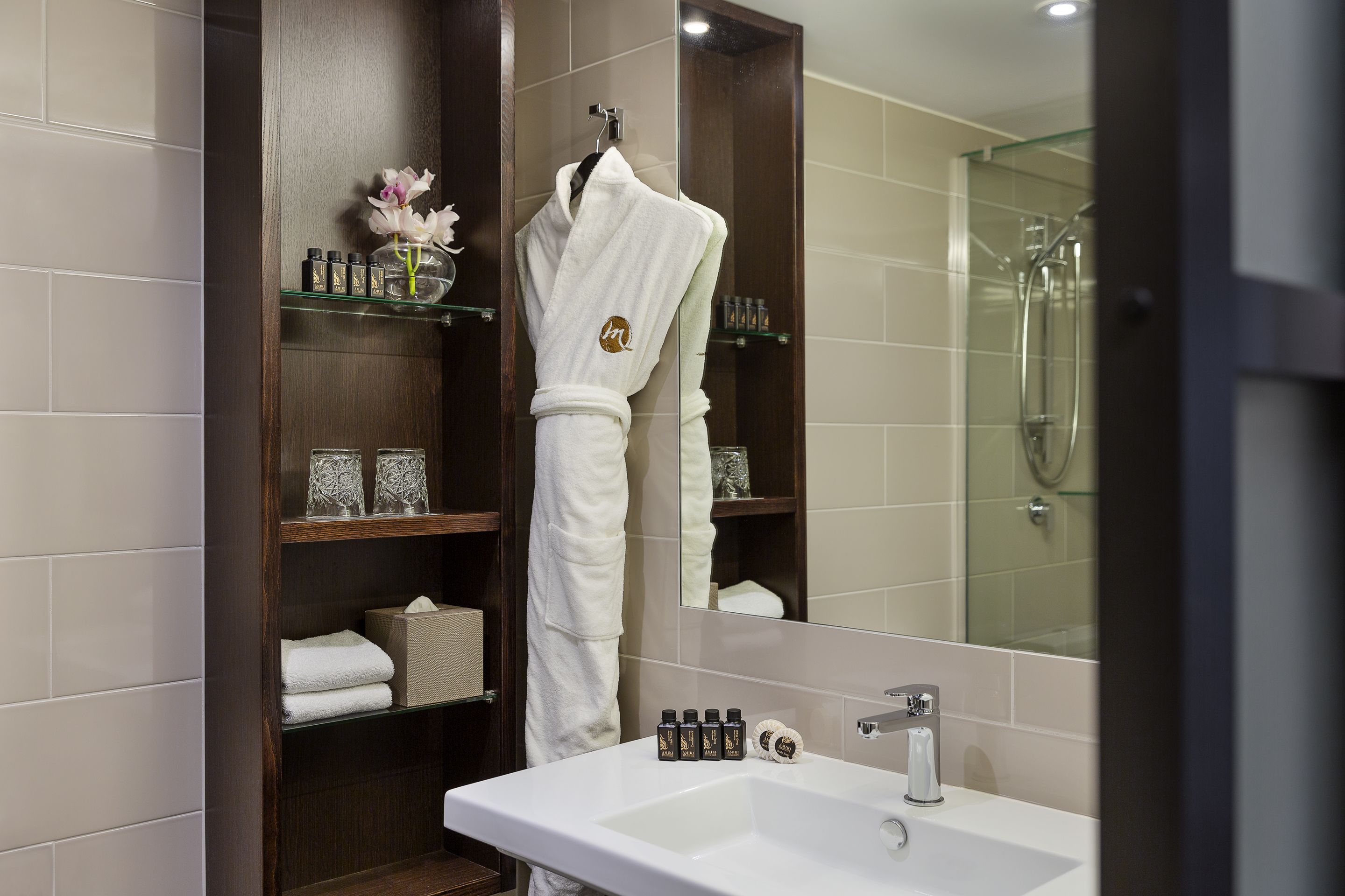 shower, designer toiletries, hair dryer, slippers