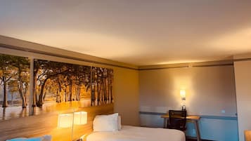 Premium bedding, desk, laptop workspace, blackout drapes