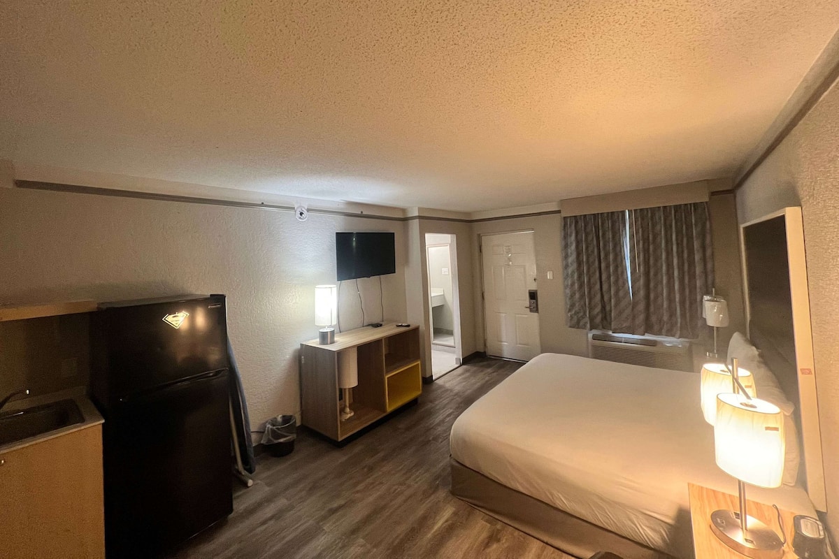 Premium bedding, desk, laptop workspace, blackout curtains