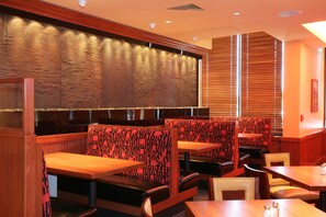Enjoy a casual dining experience in our restaurant with comfortable booths and a stylish interior.