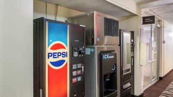 Vending machines for Pepsi and an ice dispenser in a hotel corridor.