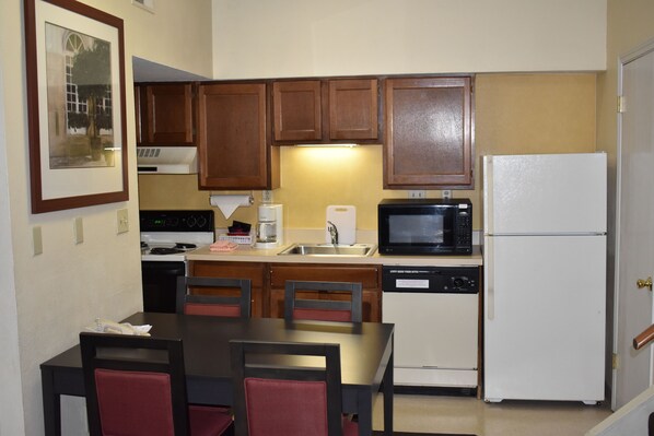 Fridge, microwave, coffee/tea maker, cookware/dishes/utensils