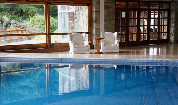 Indoor pool, open noon to 8:00 PM, pool loungers