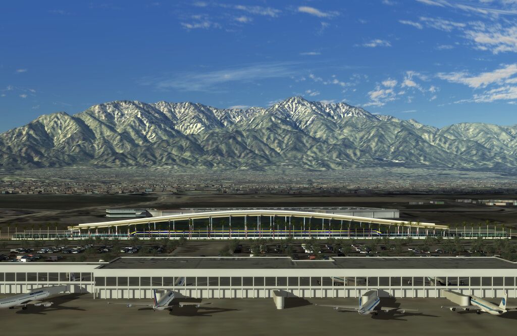 An airport terminal with a modern design, featuring a curved roof and multiple aircraft parked in front.