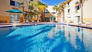 Outdoor pool, open 9 AM to 10 PM, pool umbrellas, pool loungers