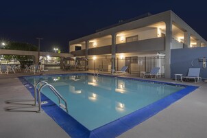 Seasonal outdoor pool, open 9:00 AM to 10:00 PM, pool umbrellas