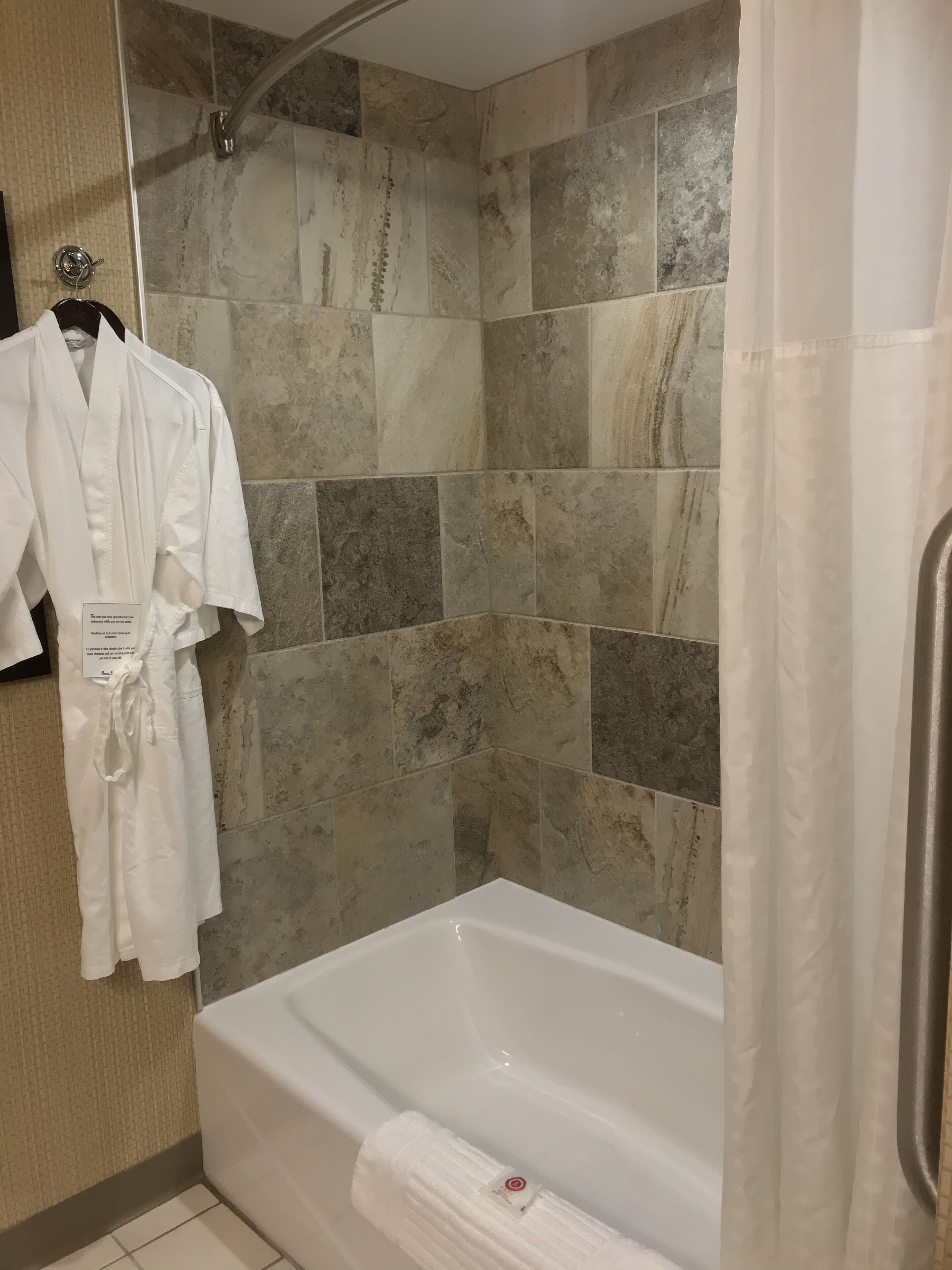 combined shower/bathtub, hair dryer, towels