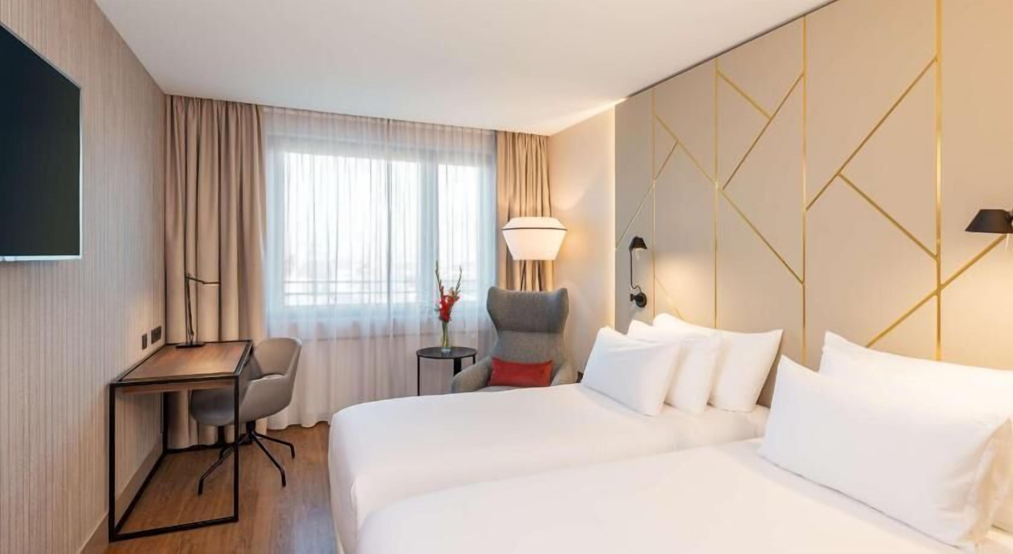 Roba de llit d'alta qualitat, minibar i caixa forta a l'habitació 