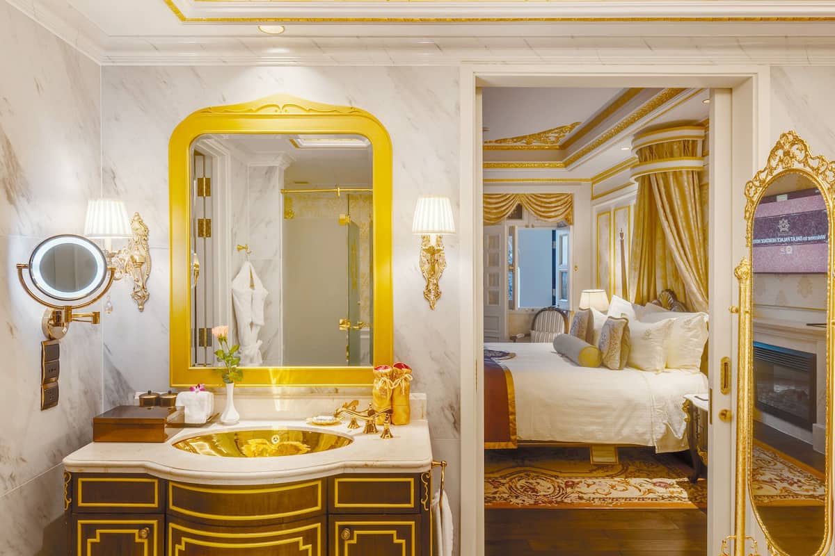 royal suite room - afternoon tea | bathroom | deep-soaking bathtub, hydromassage showerhead, free toiletries