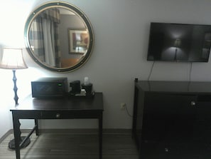 Desk, laptop workspace, blackout drapes, iron/ironing board