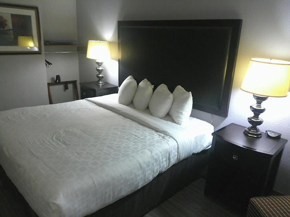 Desk, laptop workspace, blackout drapes, iron/ironing board