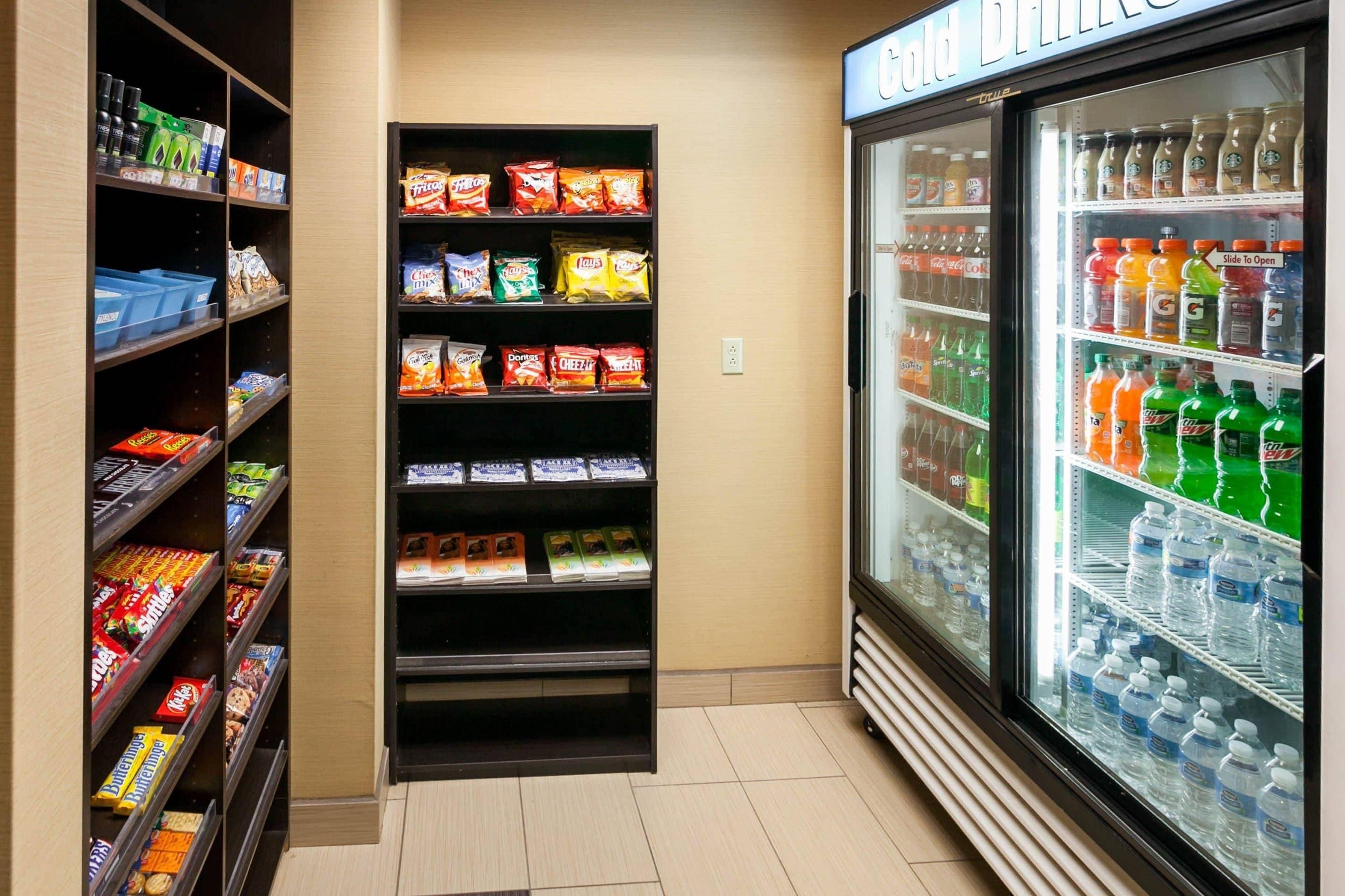 A vending machine with snacks and a refrigerator with beverages.