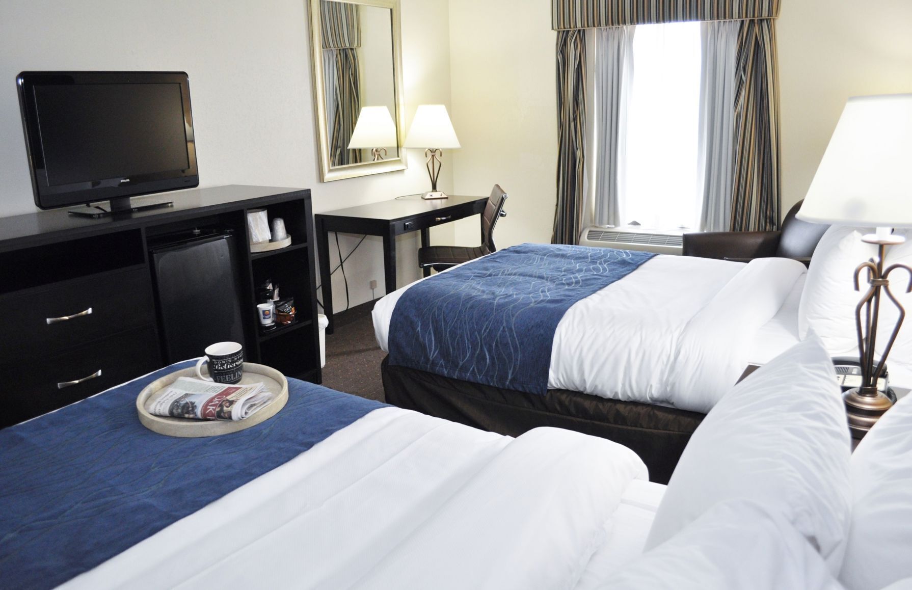 Down comforters, desk, blackout drapes, iron/ironing board