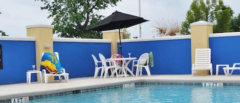 Seasonal outdoor pool, open 9 AM to 10 PM, pool umbrellas, sun loungers