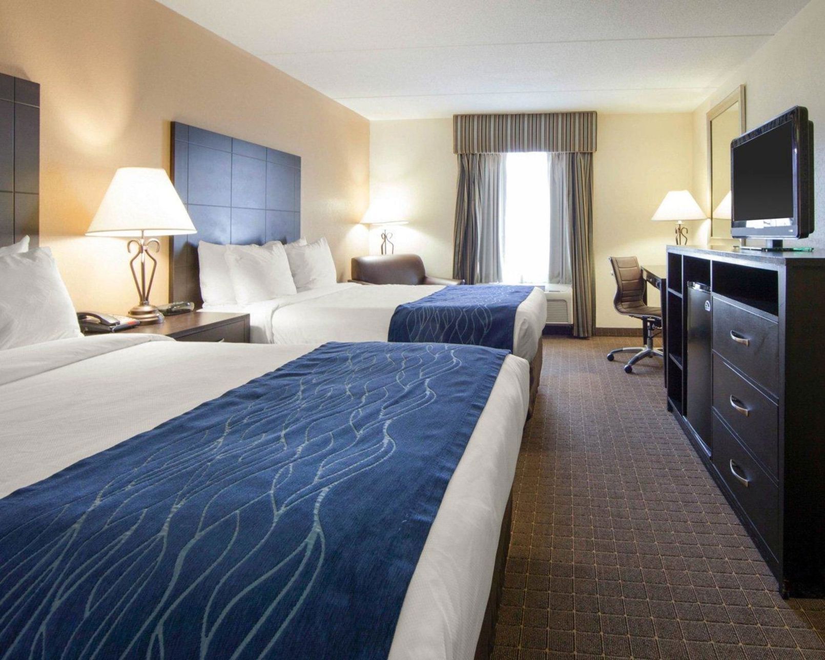 Down comforters, desk, blackout drapes, iron/ironing board