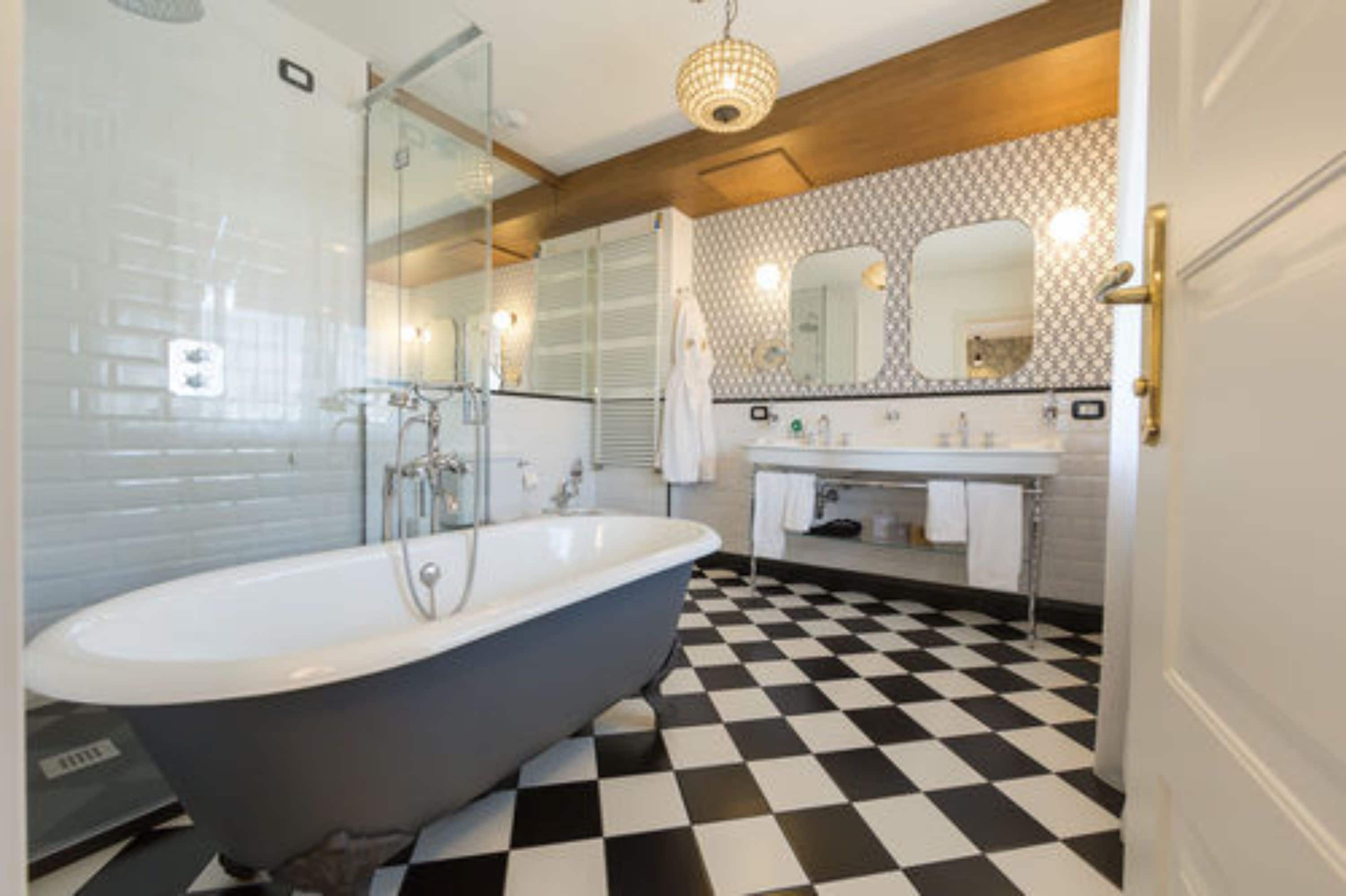 junior suite | bathroom | rainfall showerhead, hair dryer, bidet, towels