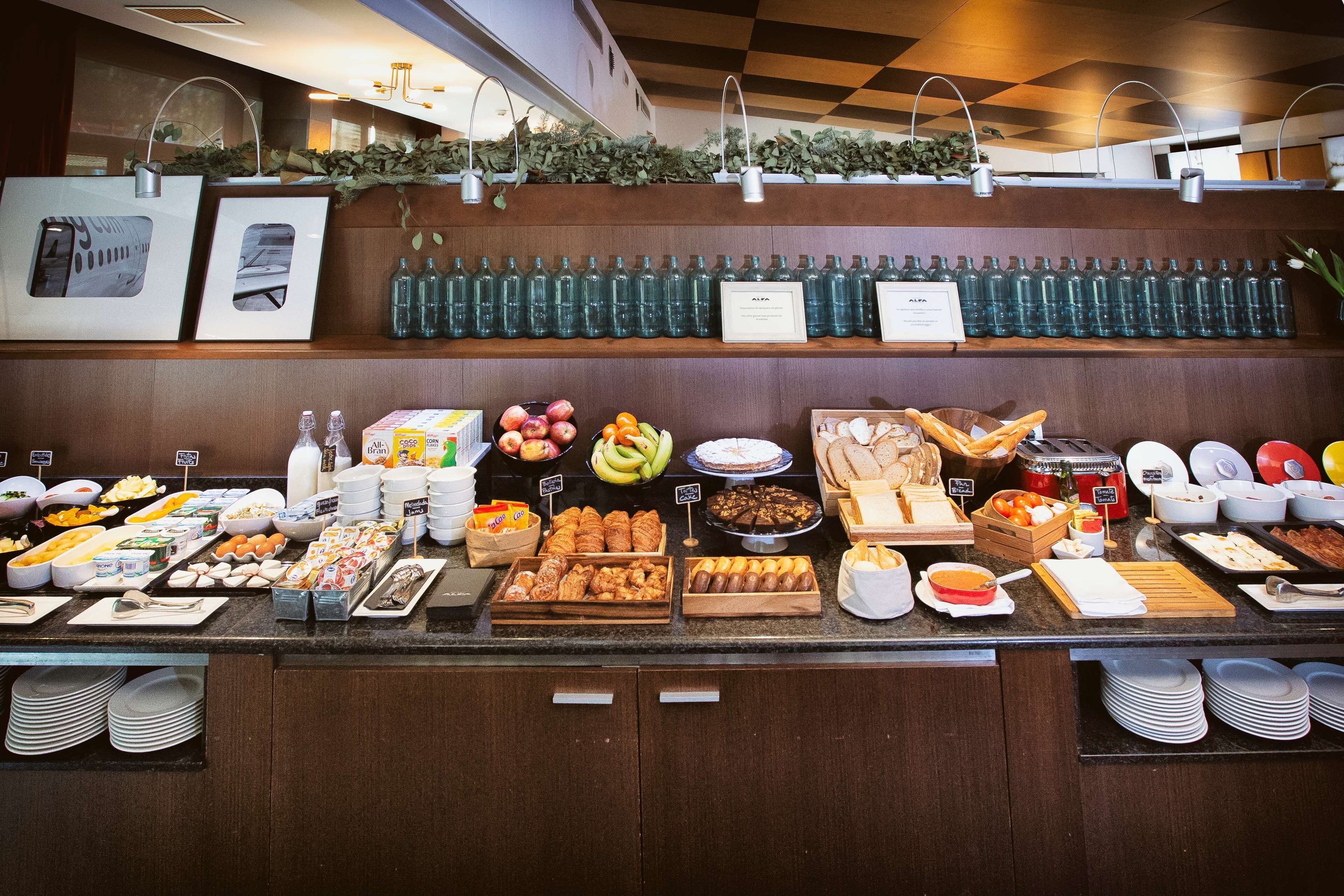 A buffet with various food items and beverages.