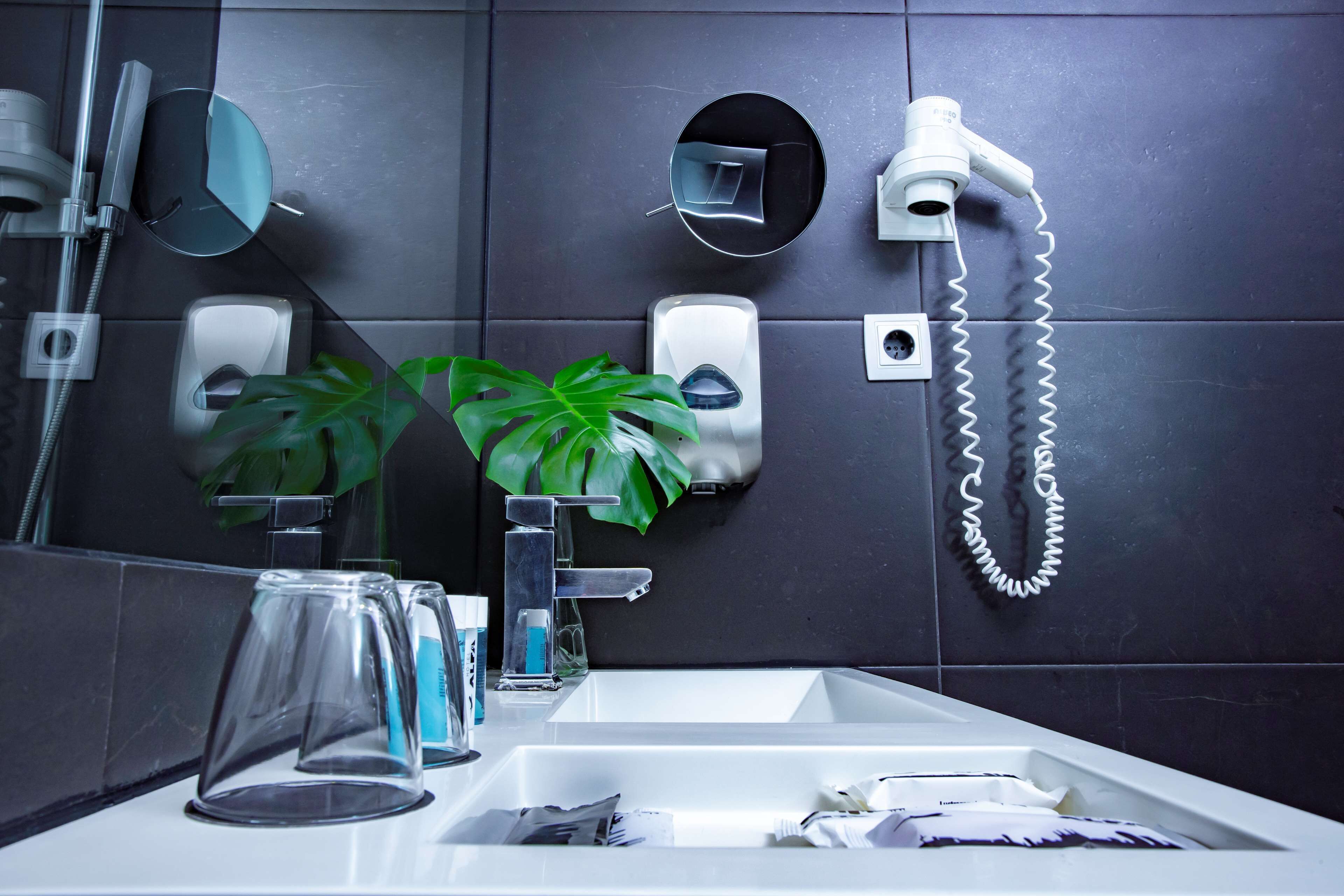 rainfall showerhead, eco-friendly toiletries, hair dryer, towels