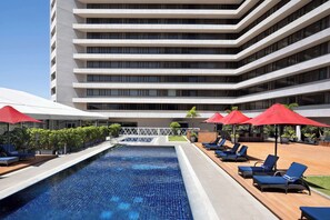 Outdoor pool, open 7:00 AM to 7:00 PM, pool loungers