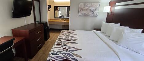 Desk, laptop workspace, blackout drapes, iron/ironing board