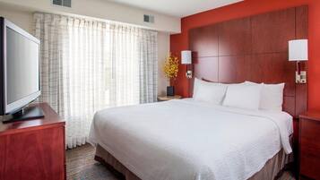 Premium bedding, desk, laptop workspace, iron/ironing board