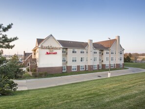 A multi-story hotel with a prominent sign reading "Residence Inn Marriott".