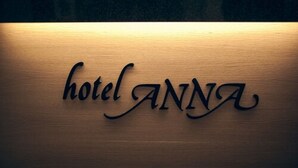 A wooden sign with the text "hotel ANNA" carved into it. - Hotel Anna (Helsinki)