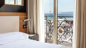 Family Room, 2 Double Beds, Beach View | Minibar, in-room safe, desk, laptop workspace