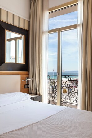 Family Room, 2 Double Beds, Beach View | Minibar, in-room safe, desk, laptop workspace