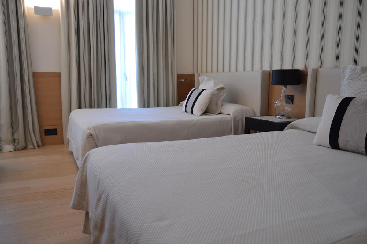 Family Room, 2 Double Beds, Bathtub | Minibar, in-room safe, desk, laptop workspace
