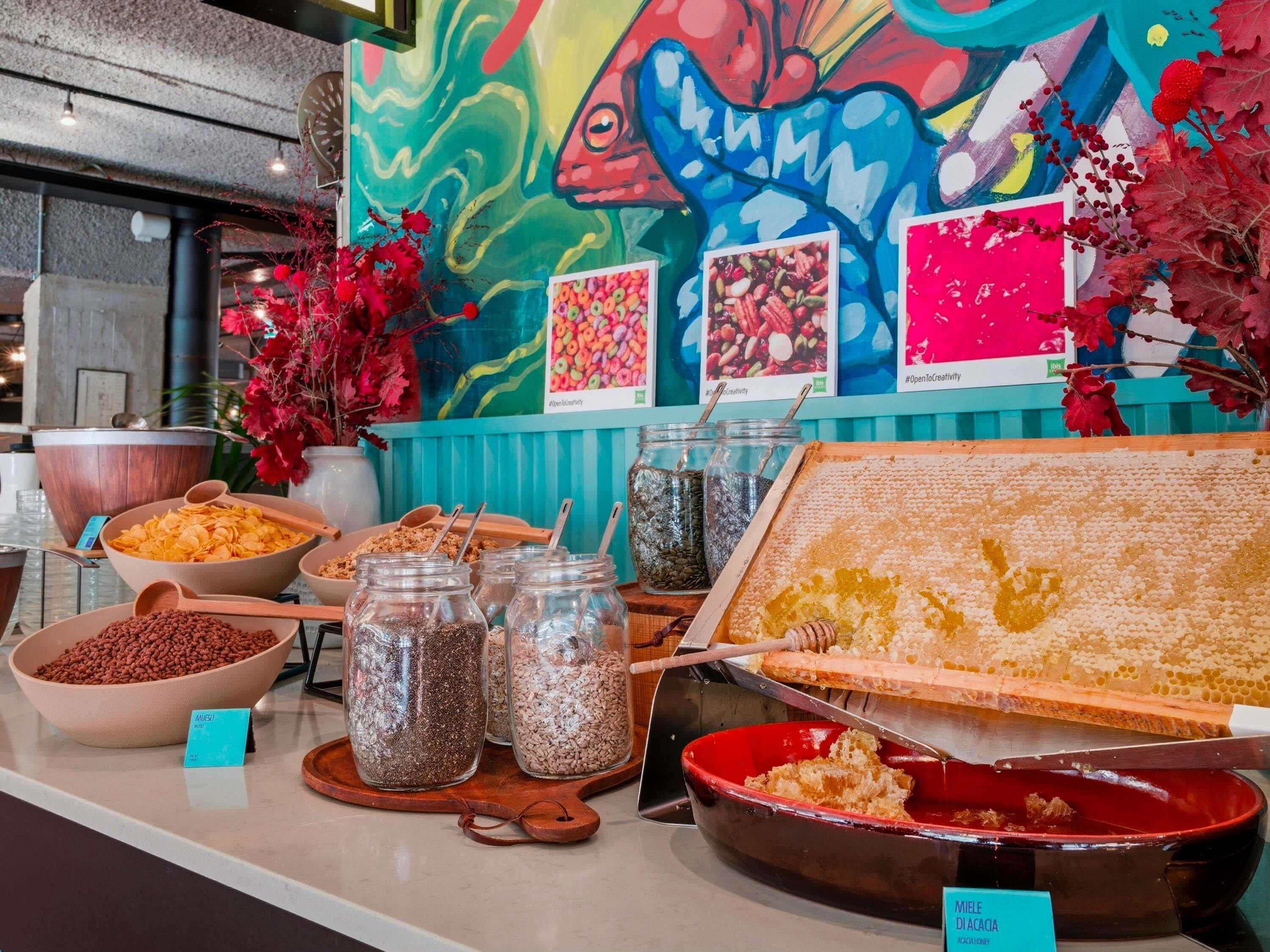 A buffet with various food items and a honeycomb display.