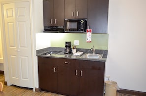 Full-size fridge, microwave, stovetop, coffee/tea maker
