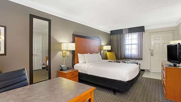 Premium bedding, desk, laptop workspace, blackout drapes