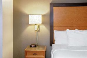 Premium bedding, desk, laptop workspace, blackout curtains