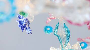 A close-up of a decorative glass ornament with a blue and white color scheme.